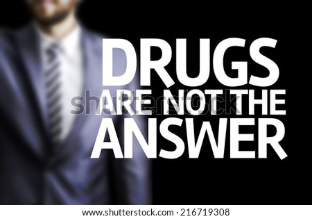 Drugs are not the Answer written on a board with a business man on background