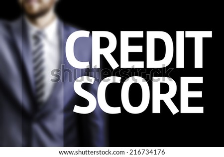 Credit Score written on a board with a business man on background