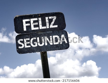 Happy Monday (In Portuguese) sign with clouds and sky background
