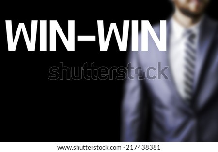 Win-Win written on a board with a business man on background