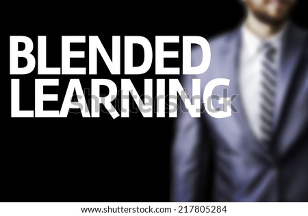 Blended Learning written on a board with a business man on background