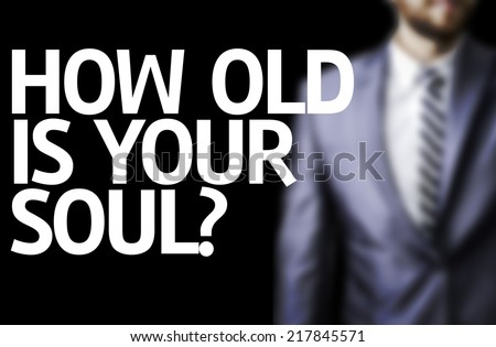 How Old Is Your Soul? written on a board with a business man on background