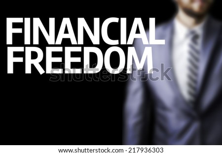 Financial Freedom written on a board with a business man on background