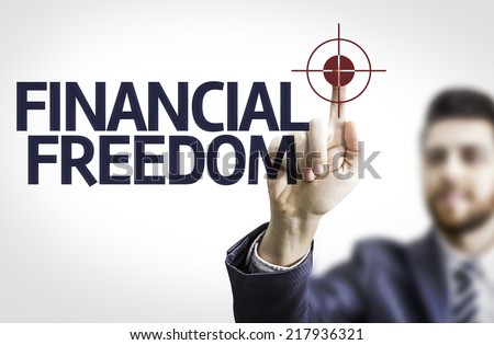 Business man pointing to transparent board with text: Financial Freedom