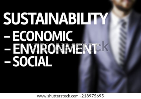 Sustainability Descriptions  written on a board with a business man on background