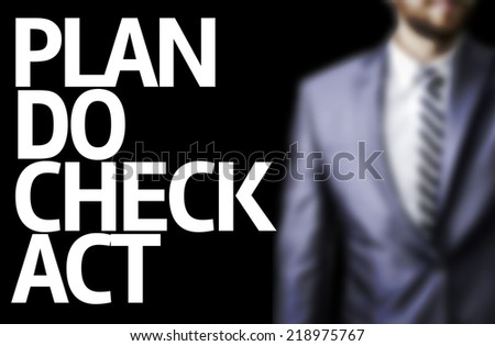 Plan Do Check Act written on a board with a business man on background