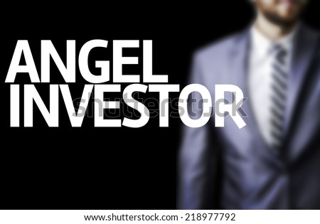 Angel Investor written on a board with a business man on background