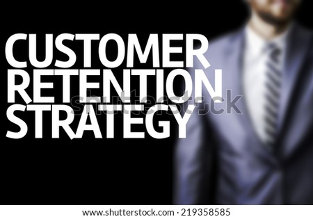 Customer Retention Strategy written on a board with a business man on background