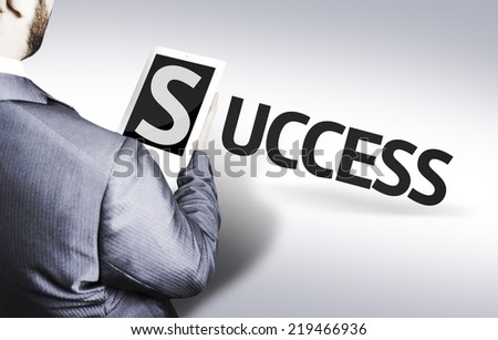 Business man with the text Success in a concept image