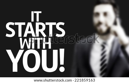 Business man with the text It Starts With You! in a concept image