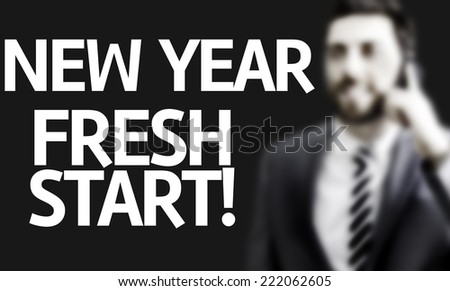 Business man with the text New Year Fresh Start in a concept image