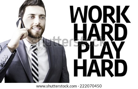 Business man with the text Work Hard Play Hard in a concept image
