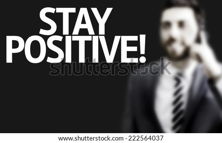 Business man with the text Stay Positive in a concept image
