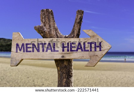 Mental Health wooden sign with a beach on background