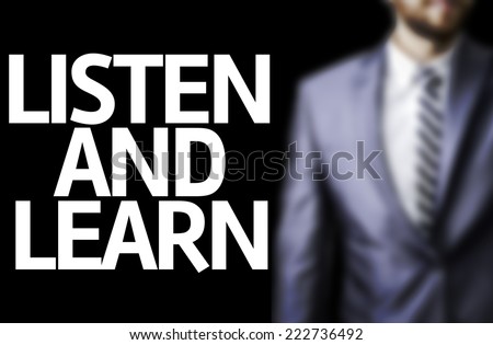 Business man with the text Listen and Learn in a concept image