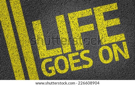 Life Goes On written on the road
