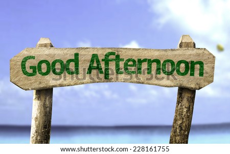 Good Afternoon sign with a beach on background