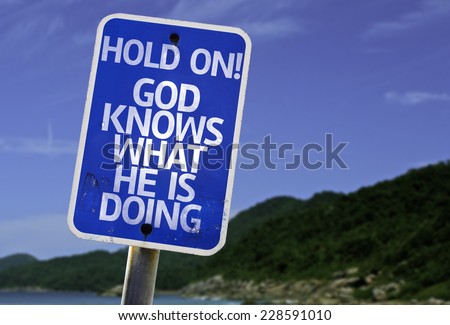 Hold On! God Knows What He is Doing sign with a beach on background