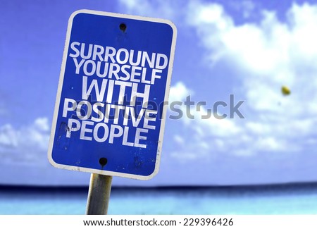 Surround Yourself with Positive People sign with a beach on background