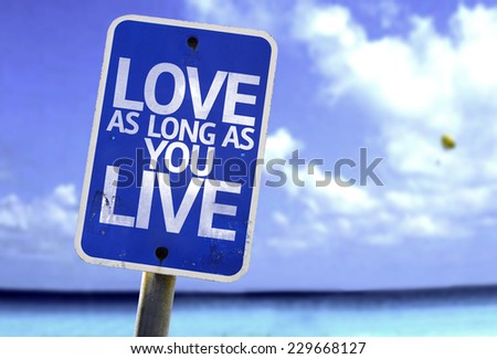 Love As Long As You Live sign with a beach on background