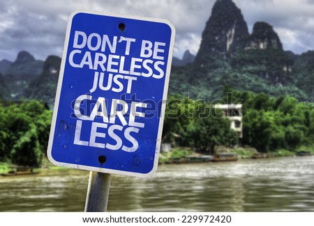Don\'t Be Careless Just Care Less sign with a forest background