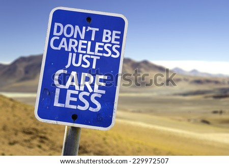 Don't Be Careless Just Care Less sign with a desert background