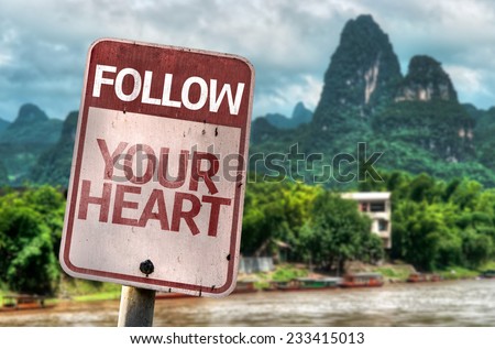 Follow Your Heart sign with a exotic landscape on background
