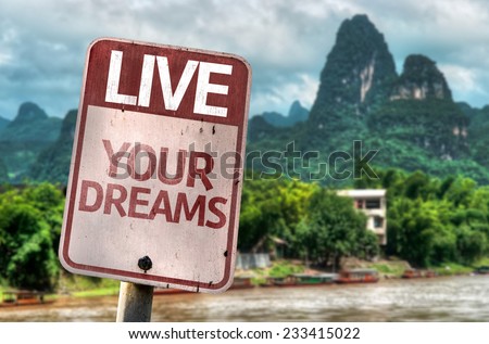 Live Your Dreams sign with a exotic landscape on background