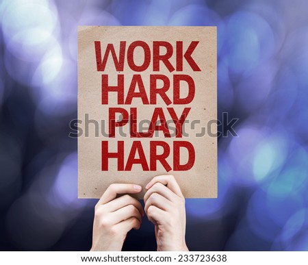 Work Hard Play Hard written on colorful background with defocused lights