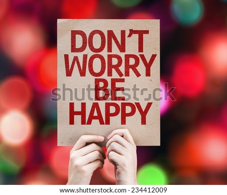 Don't Worry Be Happy written on colorful background with defocused lights