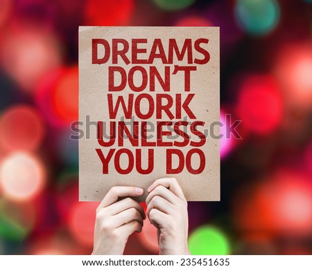 Dreams Don\'t Work Unless You Do written on colorful background with defocused lights