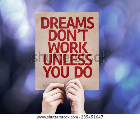 Dreams Don\'t Work Unless You Do written on colorful background with defocused lights