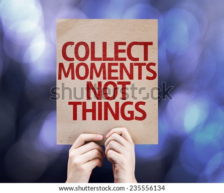 Collect Moments Not Things written on colorful background with defocused lights