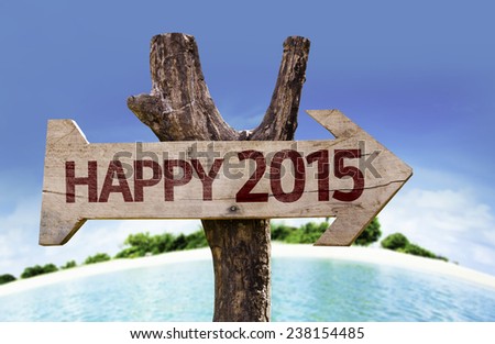 Happy 2015 sign with a beach on background
