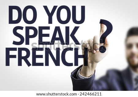 Business man pointing to transparent board with text: Do You Speak French?
