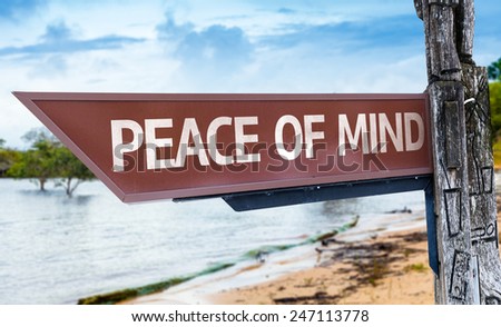 Peace of Mind wooden sign with a lake background