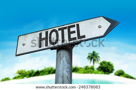 Hotel sign with a beach on background