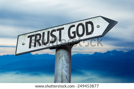 Trust God sign with sky background