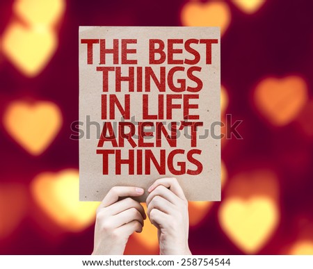 The Best Things in Life Aren\'t Things card with heart bokeh background