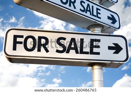 For Sale direction sign on sky background