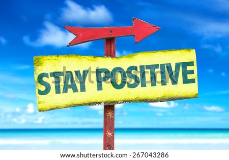 Stay Positive sign with beach background