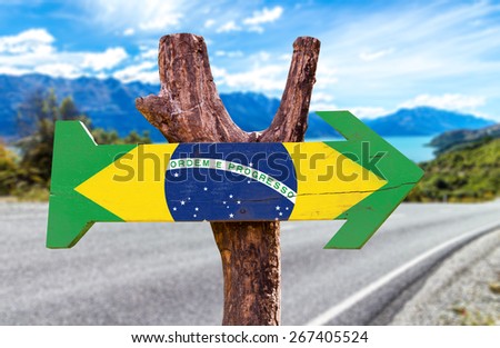 Brazil Flag wooden sign with road background