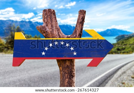 Venezuela Flag wooden sign with road background
