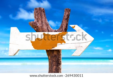 Cyprus Flag wooden sign with beach background