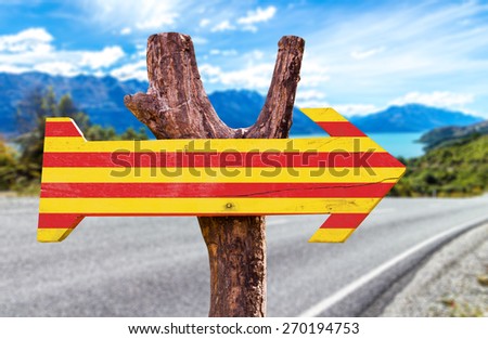 Catalonia Flag wooden sign with road background