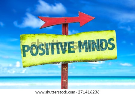 Positive Minds sign with beach background