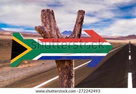 South Africa Flag wooden sign with desertic road background