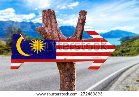 Malaysia Flag wooden sign with road background