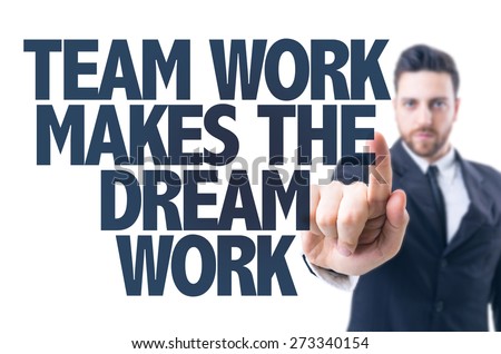 Business man pointing the text: Team Work Makes the Dream Work