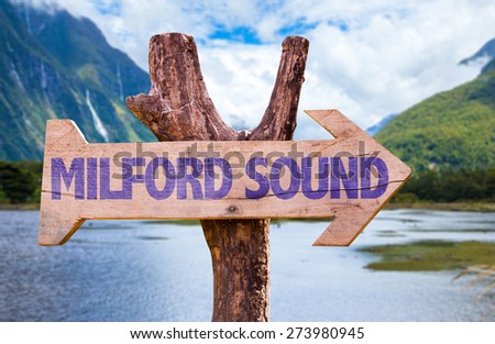 Milford Sound wooden sign with mountains background